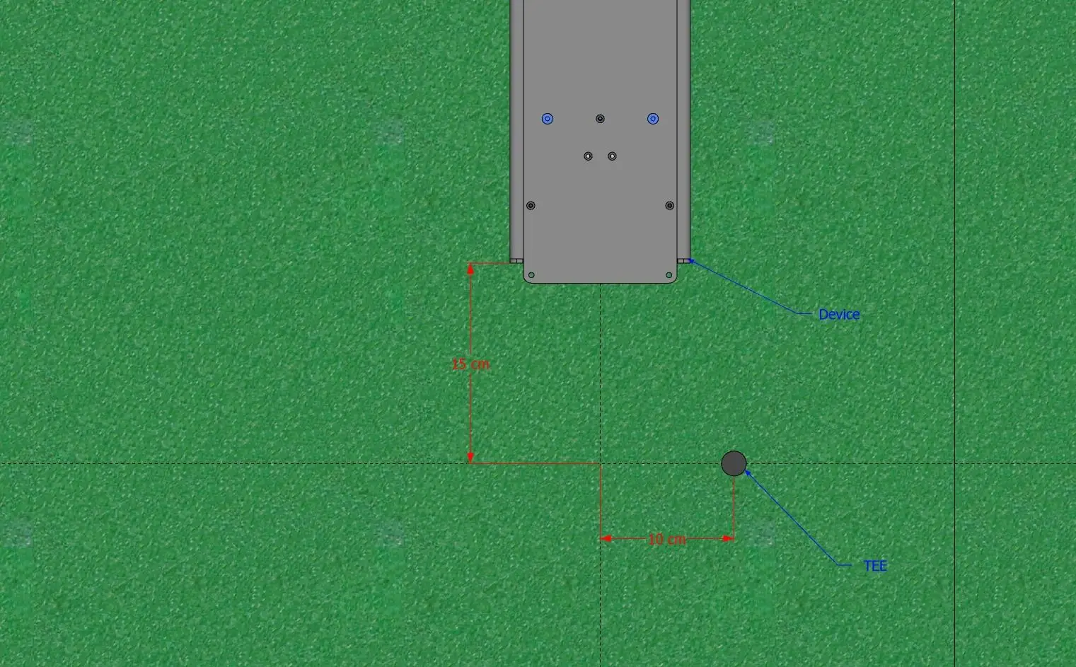 Plan view: the rear edge of the device sits 15 cm behind the tee line, and the tee sits 10 cm to the side of the device centreline